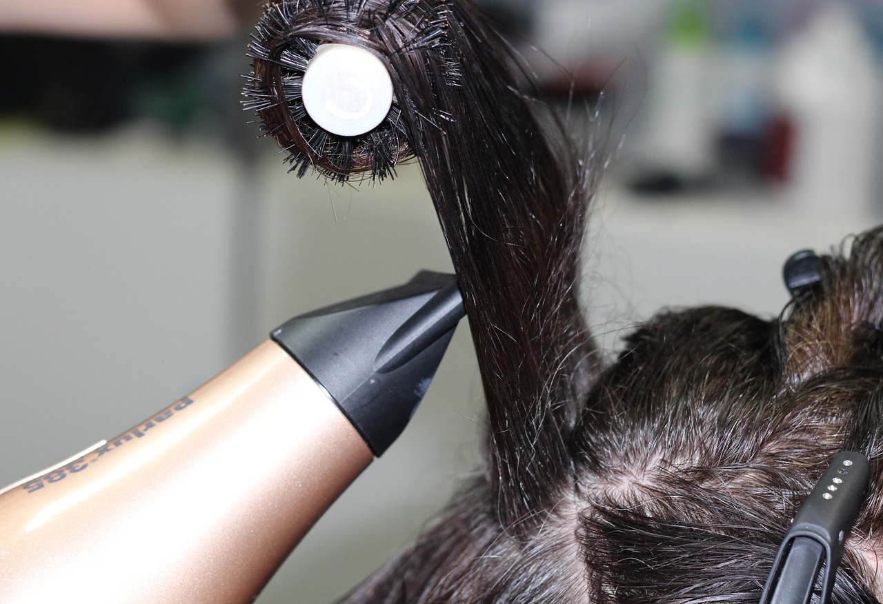 Photo of a hairdresser Blowdrying Hair